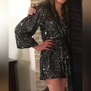 Black sequence romper. No flaws or rips. Super flattering.